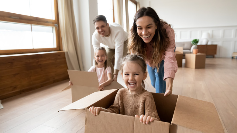 Happy renters receiving keys to a new apartment